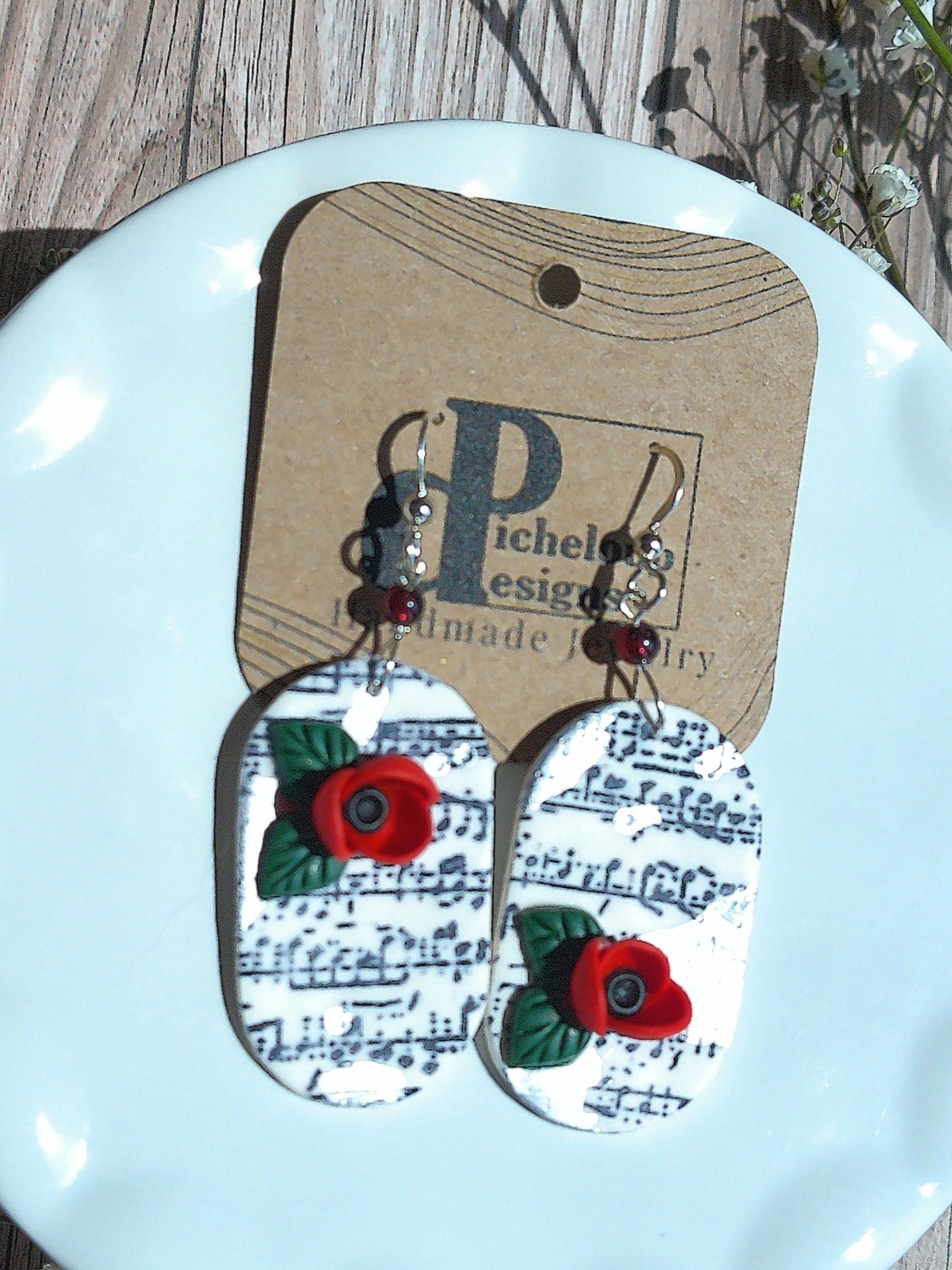 Cadence Earrings – Bold Oval Music Note Dangles with Garnet & Floral Accent