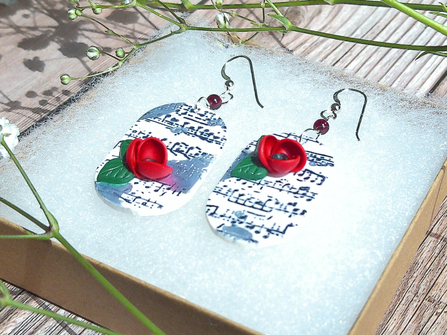 Cadence Earrings – Bold Oval Music Note Dangles with Garnet & Floral Accent