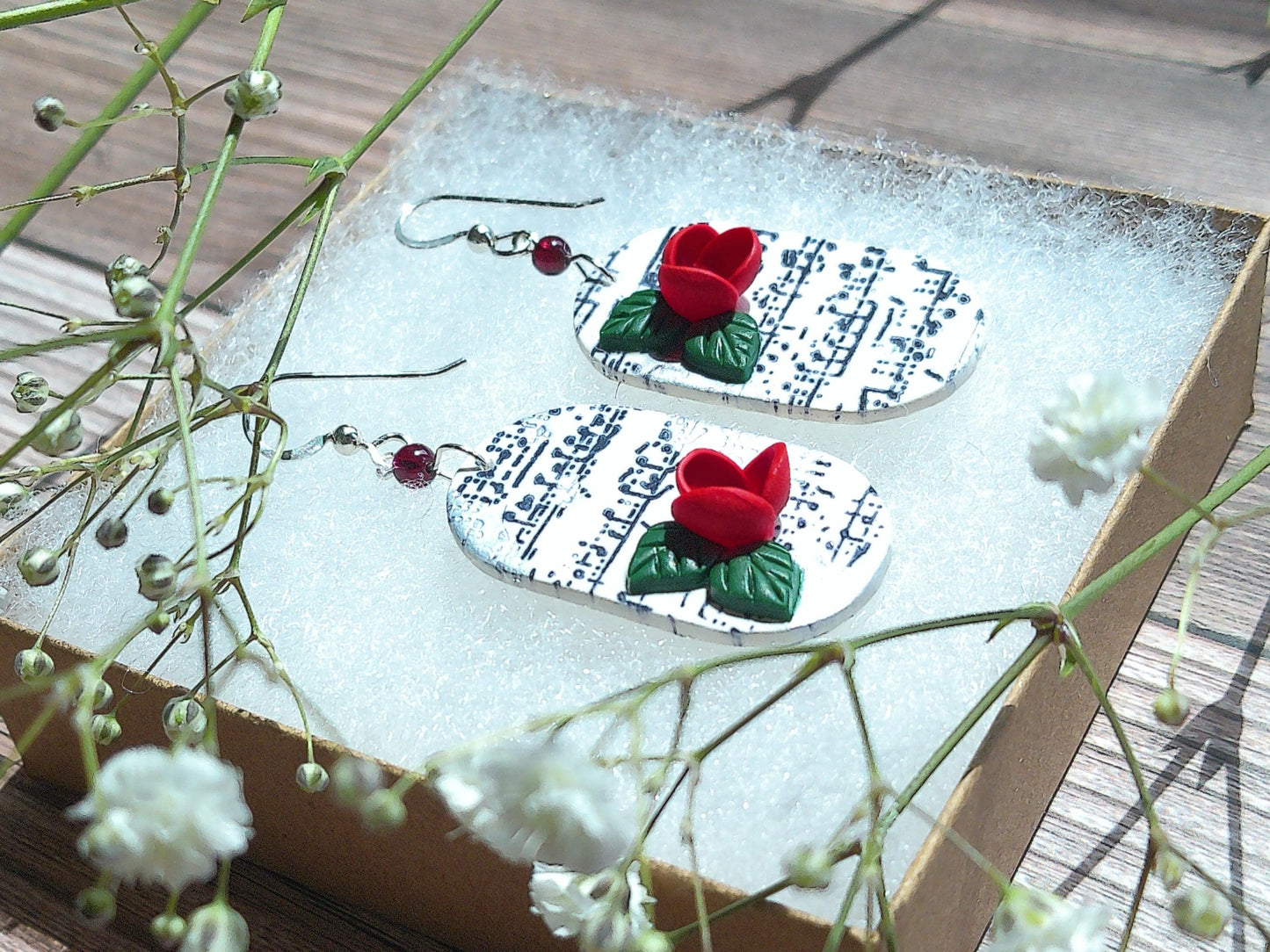 Cadence Earrings – Bold Oval Music Note Dangles with Garnet & Floral Accent