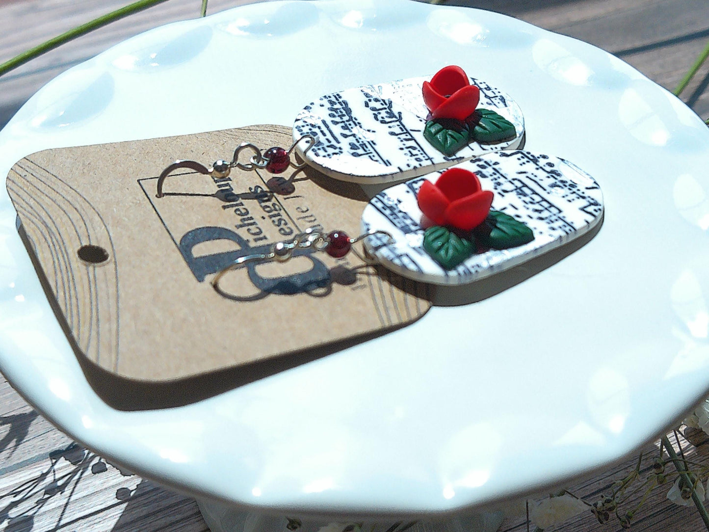 Cadence Earrings – Bold Oval Music Note Dangles with Garnet & Floral Accent