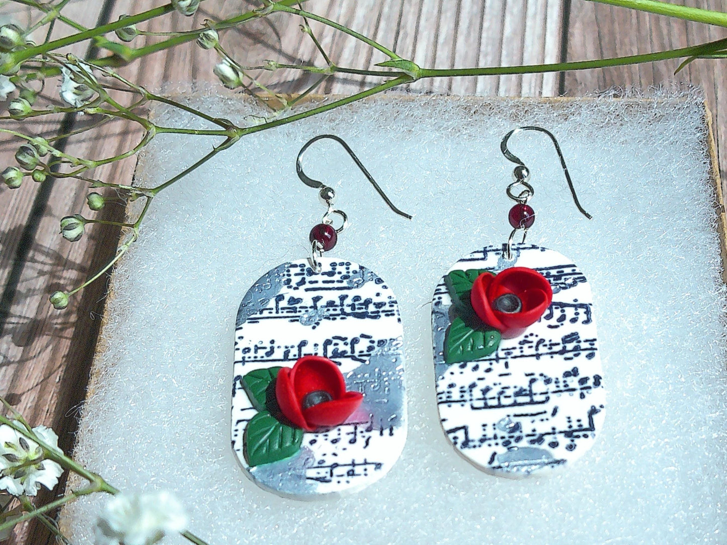Cadence Earrings – Bold Oval Music Note Dangles with Garnet & Floral Accent
