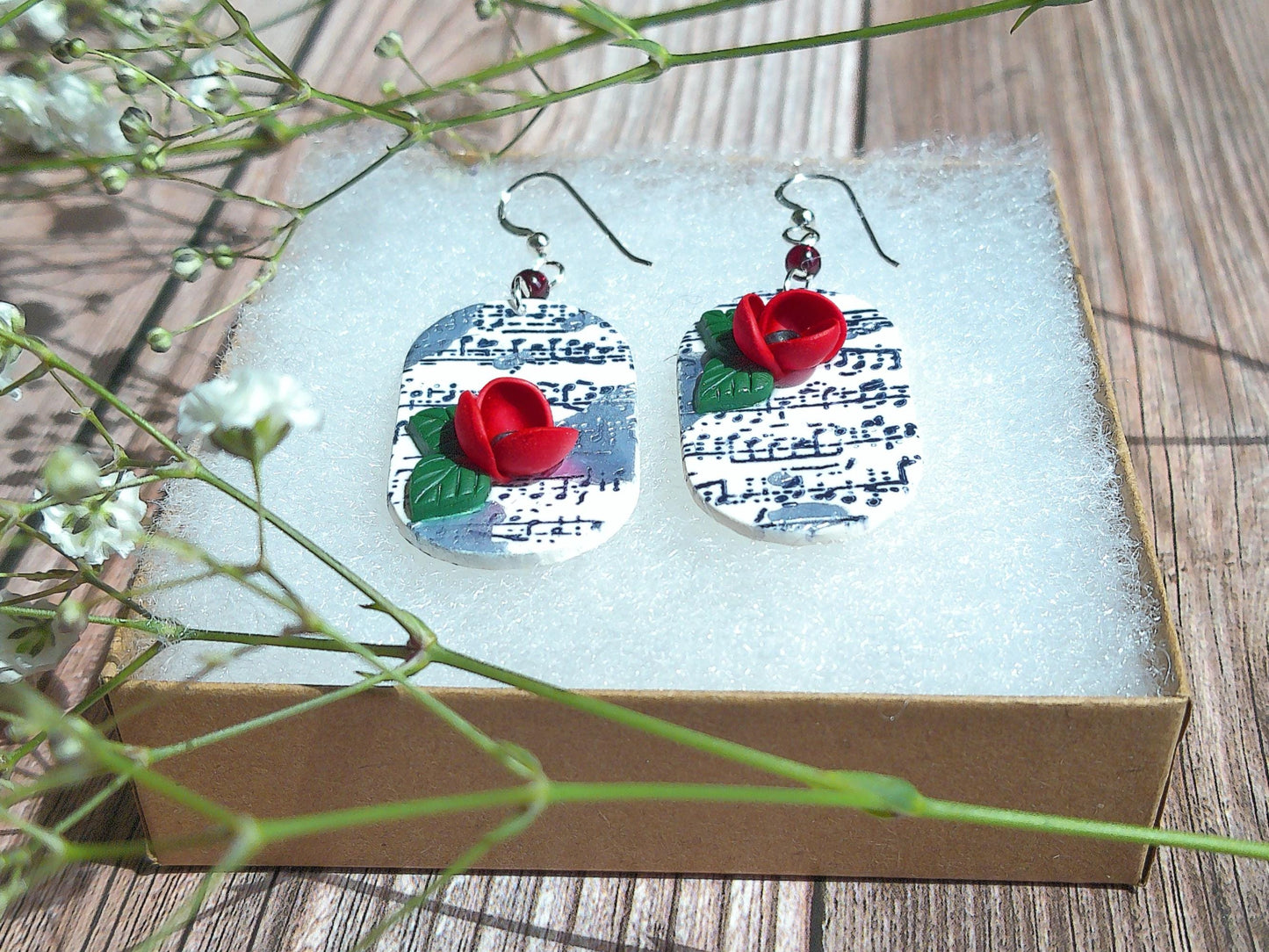 Cadence Earrings – Bold Oval Music Note Dangles with Garnet & Floral Accent