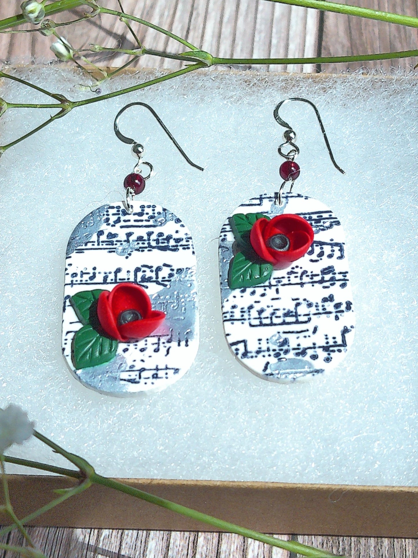 Cadence Earrings – Bold Oval Music Note Dangles with Garnet & Floral Accent